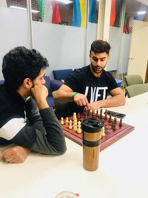 International students playing chess