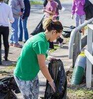 nsu big event participant cleaning up