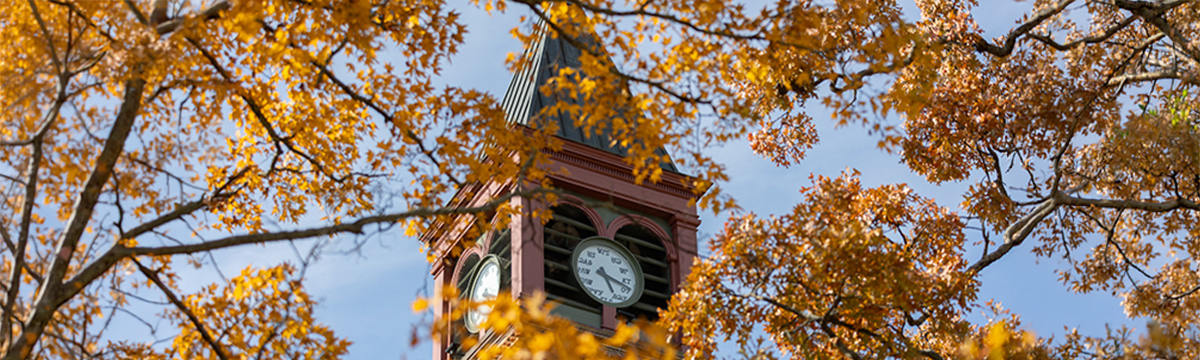 Campus scenic Seminary Hall In Fall Campus scenic of Seminary Hall Clocktower surrounded by fall leaves.