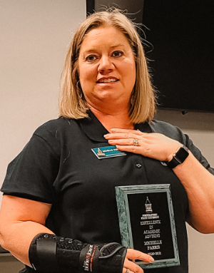 Photo of Michelle Farris with award