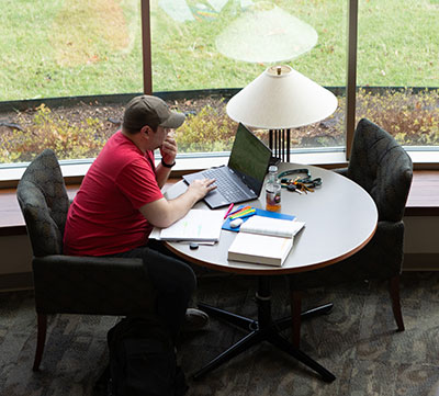 student studying on BA campus