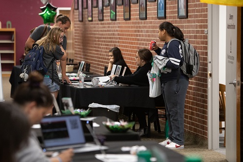 Students at information table during Study Abroad Fair
